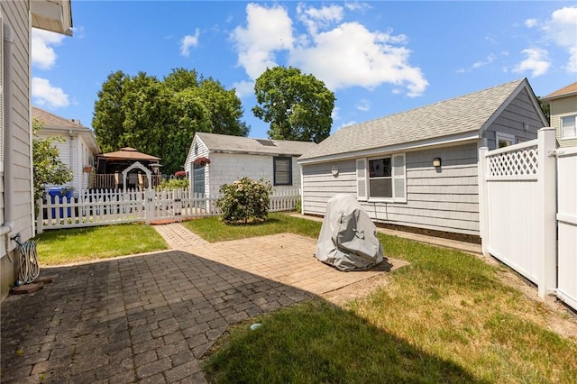 39 Owen Ave, Pawtucket, RI 02860 - back of house featuring a patio, a gazebo, and a shingled roof