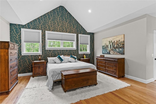 52 Pine Swamp Rd, Cumberland, RI 02864 - bedroom featuring wallpapered walls, lofted ceiling, light wood-style floors, recessed lighting, and an accent wall