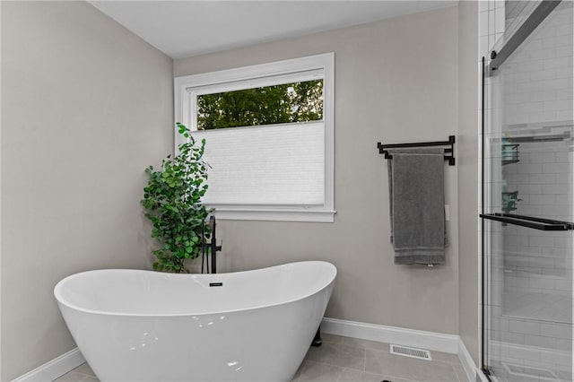 52 Pine Swamp Rd, Cumberland, RI 02864 - bathroom with a freestanding tub, a shower stall, and tile patterned flooring