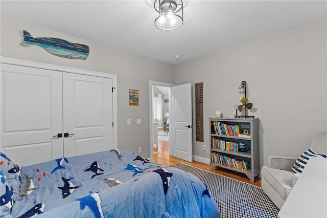 52 Pine Swamp Rd, Cumberland, RI 02864 - bedroom featuring wood finished floors and a closet