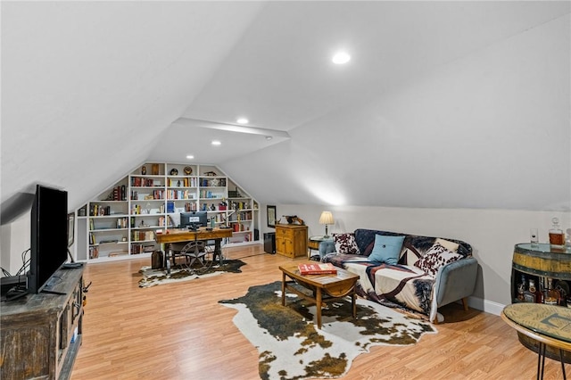 52 Pine Swamp Rd, Cumberland, RI 02864 - living area with wood finished floors, vaulted ceiling, recessed lighting, and built in shelves