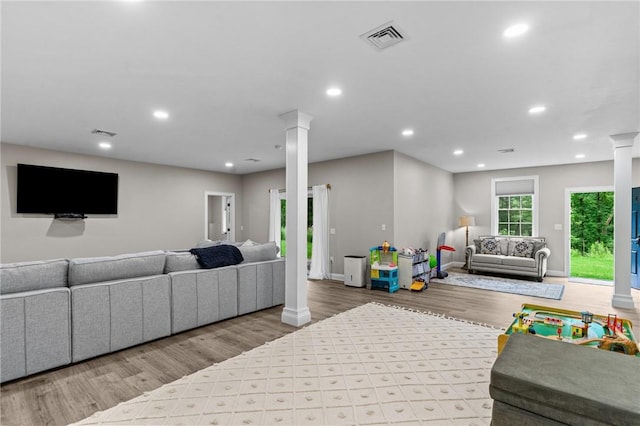 52 Pine Swamp Rd, Cumberland, RI 02864 - living room with ornate columns, wood finished floors, and recessed lighting