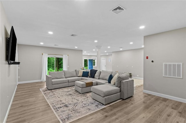 52 Pine Swamp Rd, Cumberland, RI 02864 - living area featuring ornate columns, light wood-style floors, and recessed lighting