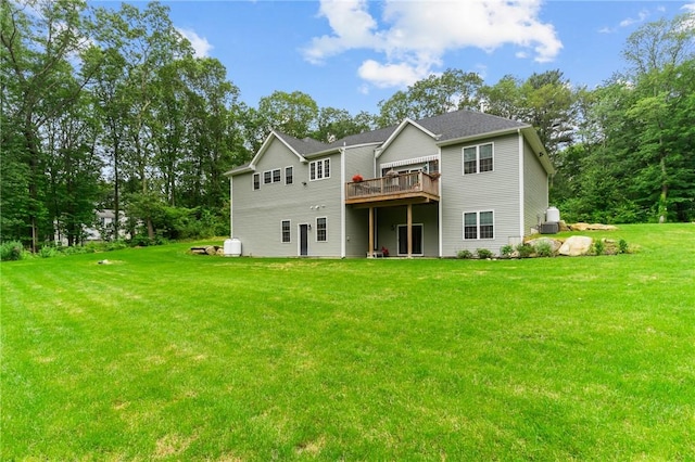 52 Pine Swamp Rd, Cumberland, RI 02864 - rear view of house featuring a lawn, a wooden deck, and view of wooded area