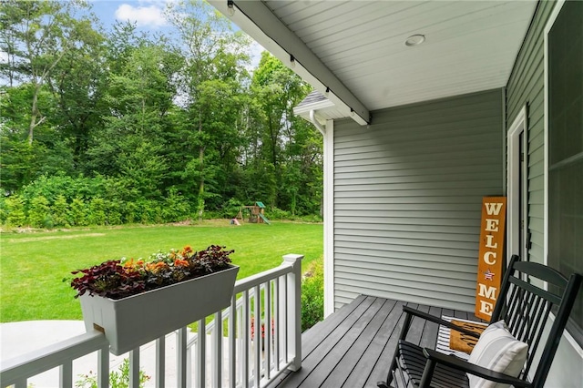 52 Pine Swamp Rd, Cumberland, RI 02864 - deck with a lawn, a playground, and an outdoor fire pit