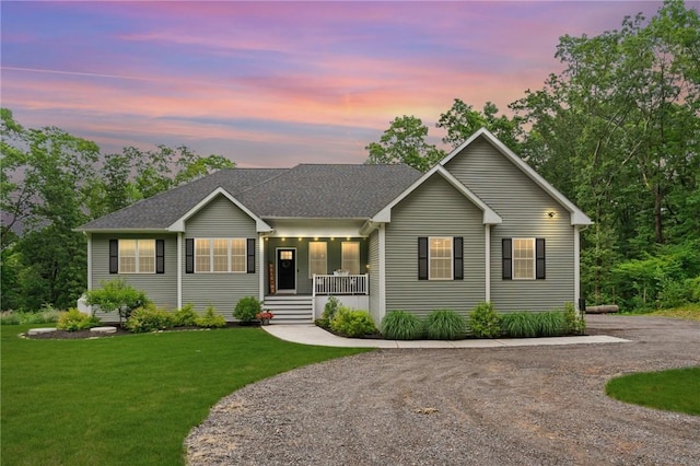 52 Pine Swamp Rd, Cumberland, RI 02864 - ranch-style house with covered porch, a lawn, and roof with shingles