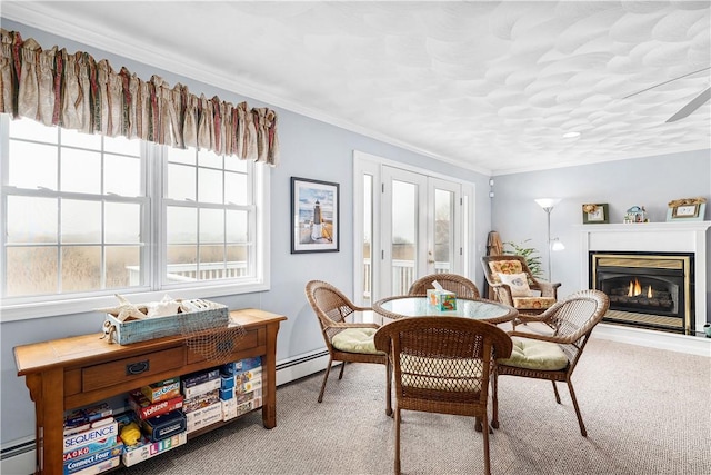 16 Elm Ave, Narragansett, RI 02882 - carpeted dining space featuring baseboard heating, a glass covered fireplace, and crown molding