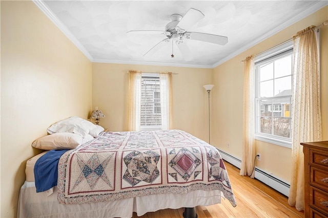 16 Elm Ave, Narragansett, RI 02882 - bedroom featuring multiple windows, light wood finished floors, crown molding, and a baseboard heating unit