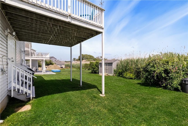 16 Elm Ave, Narragansett, RI 02882 - view of grassy yard featuring a storage unit and a wooden deck