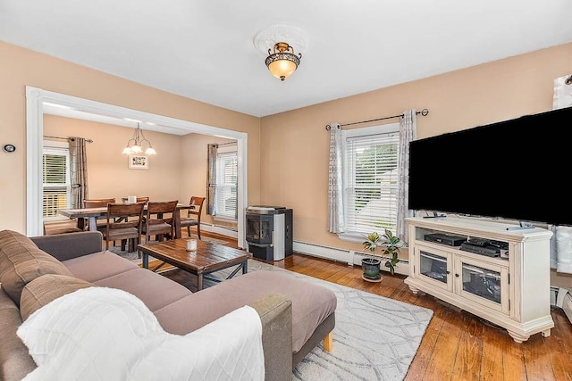 15 N St, Warwick, RI 02886 - living room featuring a chandelier, hardwood / wood-style flooring, and a baseboard radiator