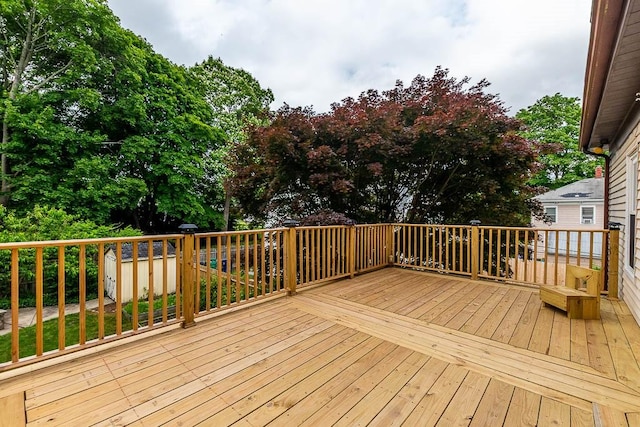15 N St, Warwick, RI 02886 - wooden deck featuring a shed and view of wooded area