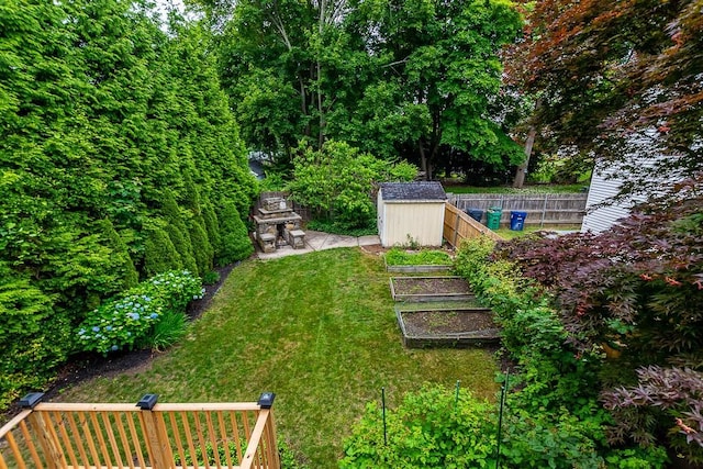 15 N St, Warwick, RI 02886 - fenced backyard featuring a shed and a vegetable garden