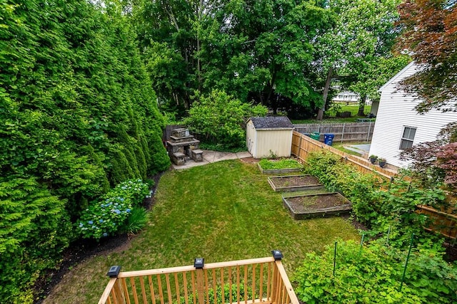 15 N St, Warwick, RI 02886 - fenced backyard featuring a garden and a storage unit