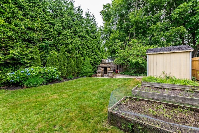 15 N St, Warwick, RI 02886 - view of yard featuring a garden and an outdoor stone fireplace