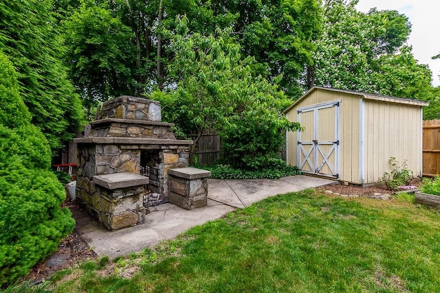 15 N St, Warwick, RI 02886 - view of yard featuring a storage shed and an outdoor stone fireplace