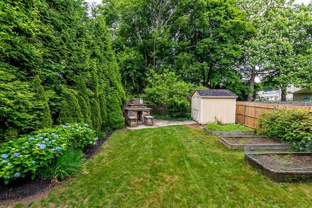 15 N St, Warwick, RI 02886 - view of yard featuring a vegetable garden and a shed