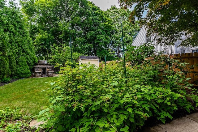 15 N St, Warwick, RI 02886 - view of yard featuring a shed and an outdoor stone fireplace
