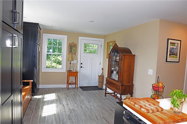 2352 Matunuck Schoolhouse Rd, Charlestown, RI 02813 - entrance foyer featuring wood finished floors and baseboards