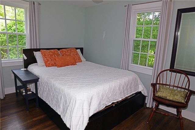 2352 Matunuck Schoolhouse Rd, Charlestown, RI 02813 - bedroom featuring dark wood-style flooring and multiple windows