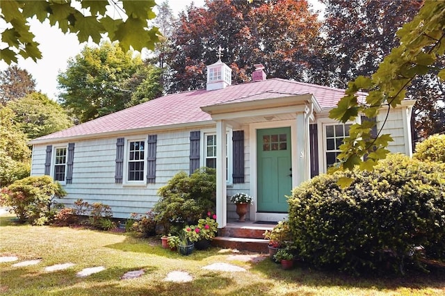 2352 Matunuck Schoolhouse Rd, Charlestown, RI 02813 - view of front facade with a front yard and a chimney