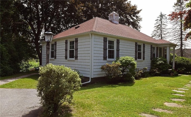 2352 Matunuck Schoolhouse Rd, Charlestown, RI 02813 - view of side of home with a yard and a shingled roof
