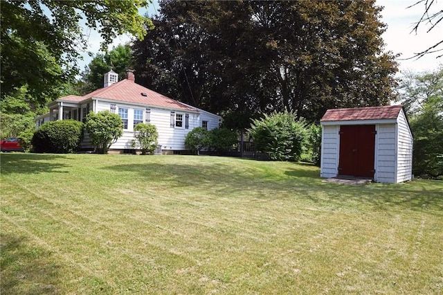 2352 Matunuck Schoolhouse Rd, Charlestown, RI 02813 - view of green lawn with a storage unit and view of scattered trees