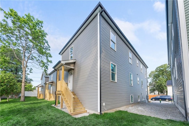 137 Stanwood St, Providence, RI 02907 - rear view of property featuring a lawn