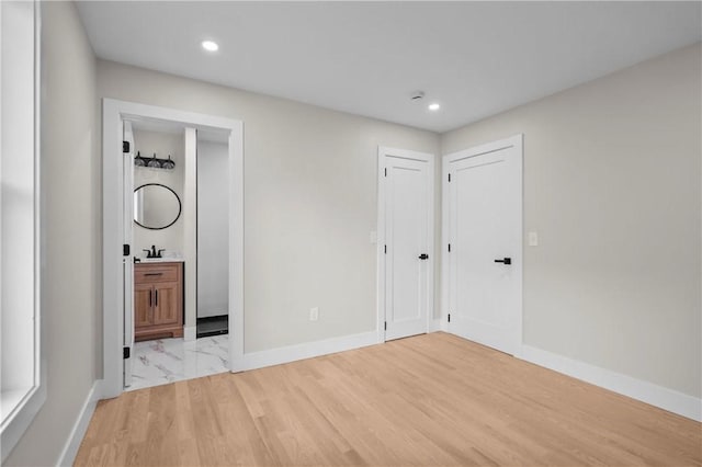 137 Stanwood St, Providence, RI 02907 - unfurnished bedroom with recessed lighting, light wood-type flooring, and ensuite bathroom