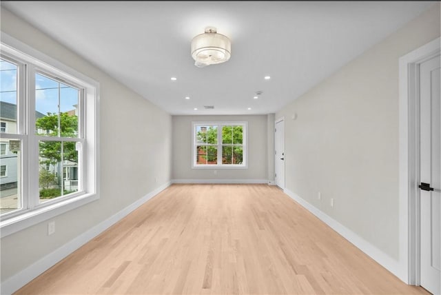 137 Stanwood St, Providence, RI 02907 - empty room with light wood-style flooring and recessed lighting