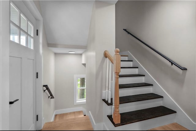 137 Stanwood St, Providence, RI 02907 - stairway with healthy amount of natural light, wood finished floors, and a high ceiling