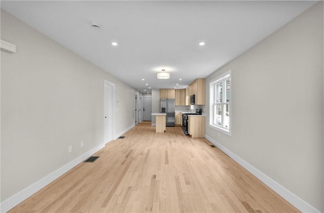 137 Stanwood St, Providence, RI 02907 - unfurnished living room featuring light wood finished floors and recessed lighting