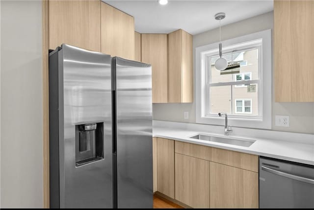 137 Stanwood St, Providence, RI 02907 - kitchen featuring appliances with stainless steel finishes, light brown cabinets, and light countertops