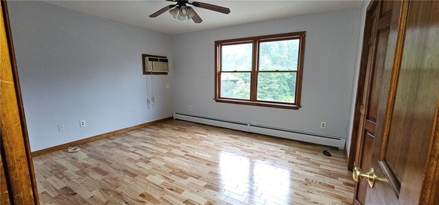 79 Cucumber Hill Rd, Foster, RI 02825 - spare room featuring a baseboard heating unit, light wood-type flooring, ceiling fan, and a wall mounted AC