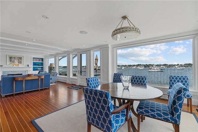 19 Defenders Row Unit 19, Newport, RI 02840 - dining area with wood finished floors, a water view, and recessed lighting