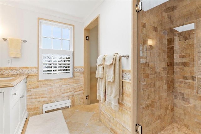 19 Defenders Row Unit 19, Newport, RI 02840 - full bathroom with tile walls, a stall shower, vanity, a wainscoted wall, and tile patterned floors