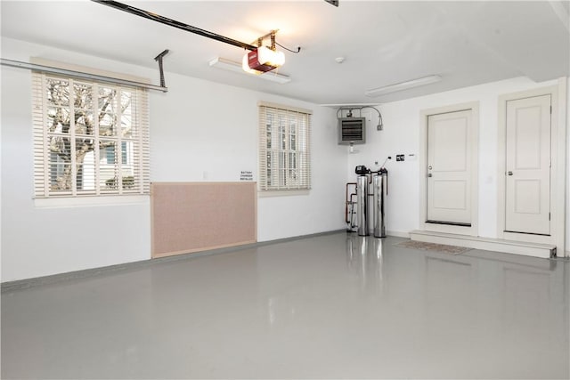 19 Defenders Row Unit 19, Newport, RI 02840 - garage with a garage door opener and a heating unit