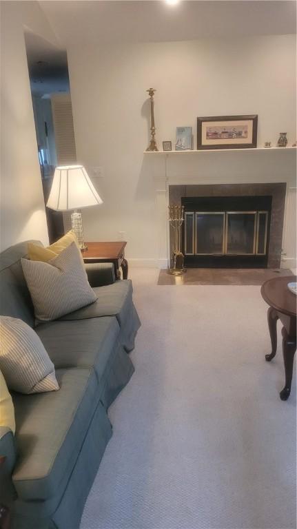 318 Corey Ln Unit 318, Middletown, RI 02842 - living area featuring a glass covered fireplace and carpet flooring