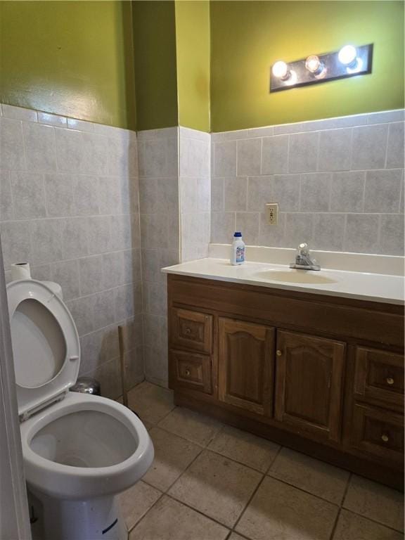 133 Byfield St, Providence, RI 02905 - bathroom with tile walls, vanity, and tile patterned flooring