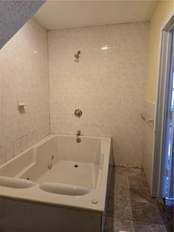 133 Byfield St, Providence, RI 02905 - bathroom featuring tile walls and a tub with jets