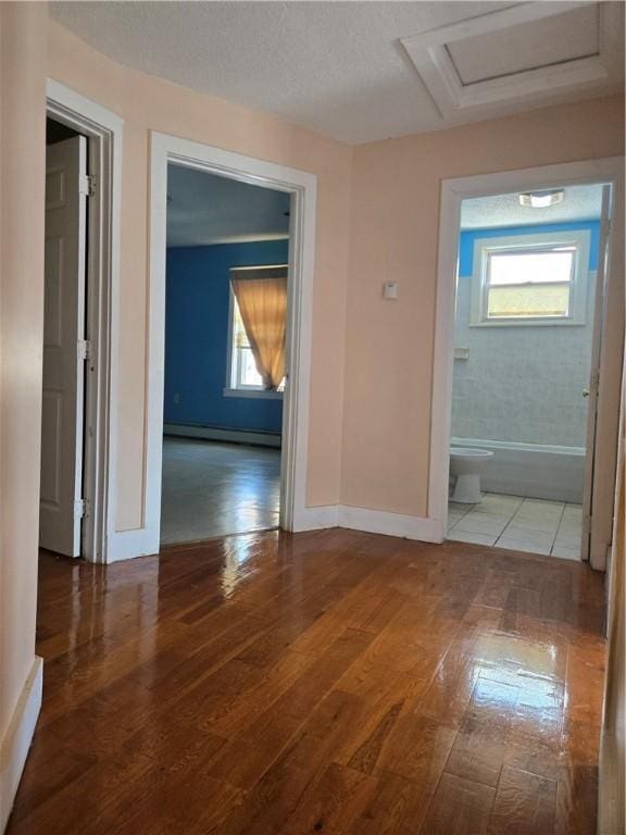133 Byfield St, Providence, RI 02905 - hall featuring baseboard heating, attic access, and wood-type flooring