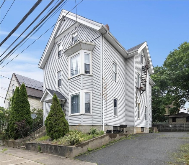 35 Fountain St, Pawtucket, RI 02860 - view of home's exterior featuring a chimney