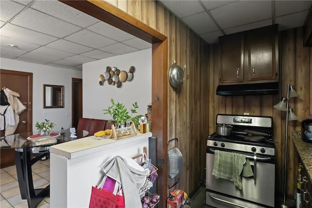 35 Fountain St, Pawtucket, RI 02860 - kitchen featuring stainless steel gas range, a paneled ceiling, under cabinet range hood, wooden walls, and a peninsula