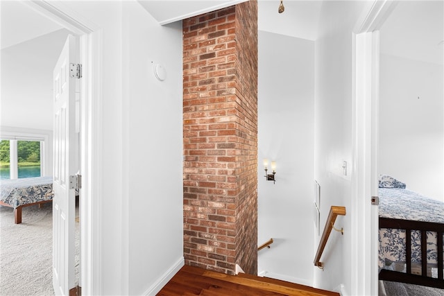 267 Fishing Cove Rd, North Kingstown, RI 02852 - stairway with baseboards and wood finished floors