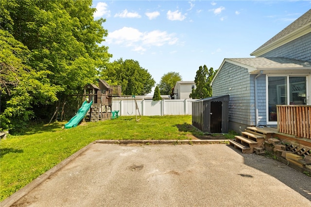 4 S Cornell Ave, Warren, RI 02885 - view of yard with a patio, a playground, and a storage shed
