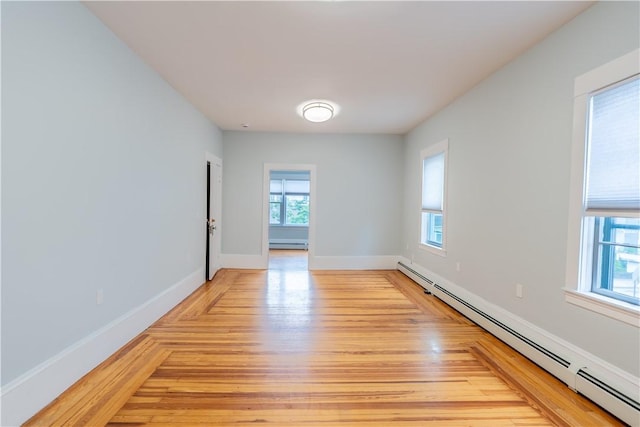 168 Waterman Ave, East Providence, RI 02914 - empty room featuring baseboard heating and light wood finished floors