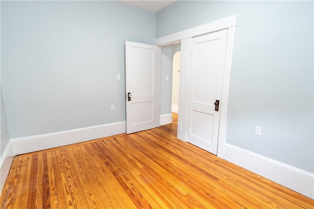 168 Waterman Ave, East Providence, RI 02914 - spare room with arched walkways and light wood finished floors