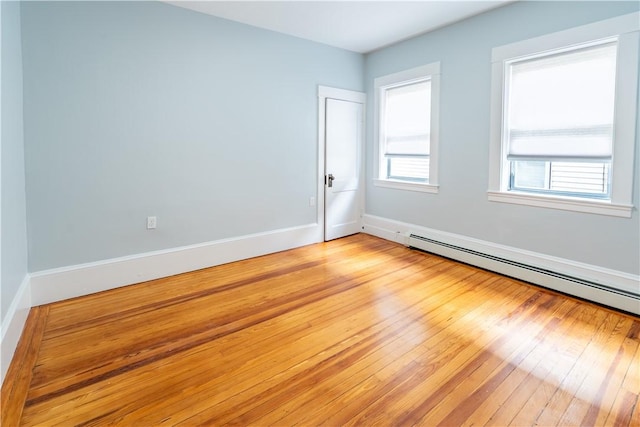 168 Waterman Ave, East Providence, RI 02914 - unfurnished room with a baseboard heating unit and light wood-type flooring