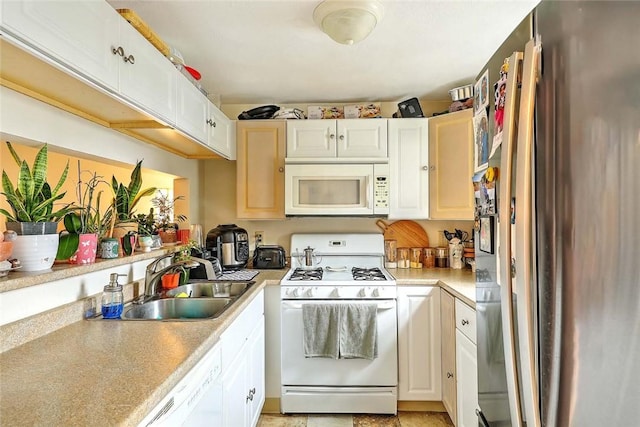 25 Sharon St Unit 1, Cranston, RI 02910 - kitchen with white appliances, light countertops, and white cabinetry