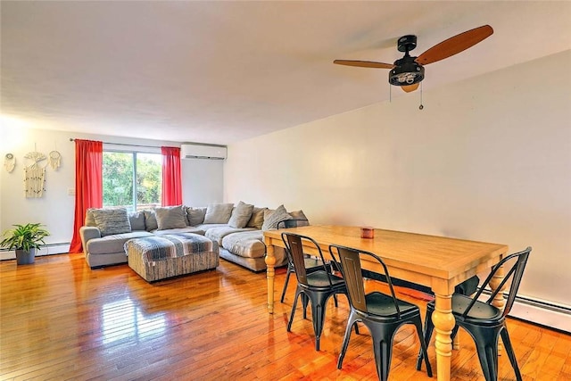 25 Sharon St Unit 1, Cranston, RI 02910 - living room featuring a wall mounted air conditioner, light wood finished floors, a ceiling fan, and baseboard heating