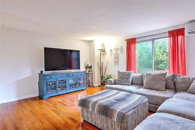 25 Sharon St Unit 1, Cranston, RI 02910 - living area featuring light wood-style flooring and a wall unit AC